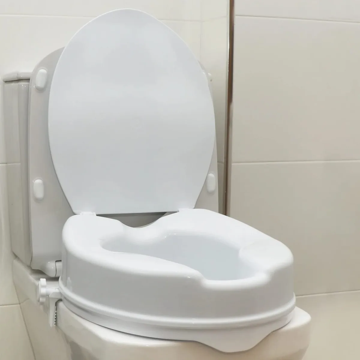 OrtoPrime Elevador de WC con tapa, 10 cm, cierres laterales de seguridad